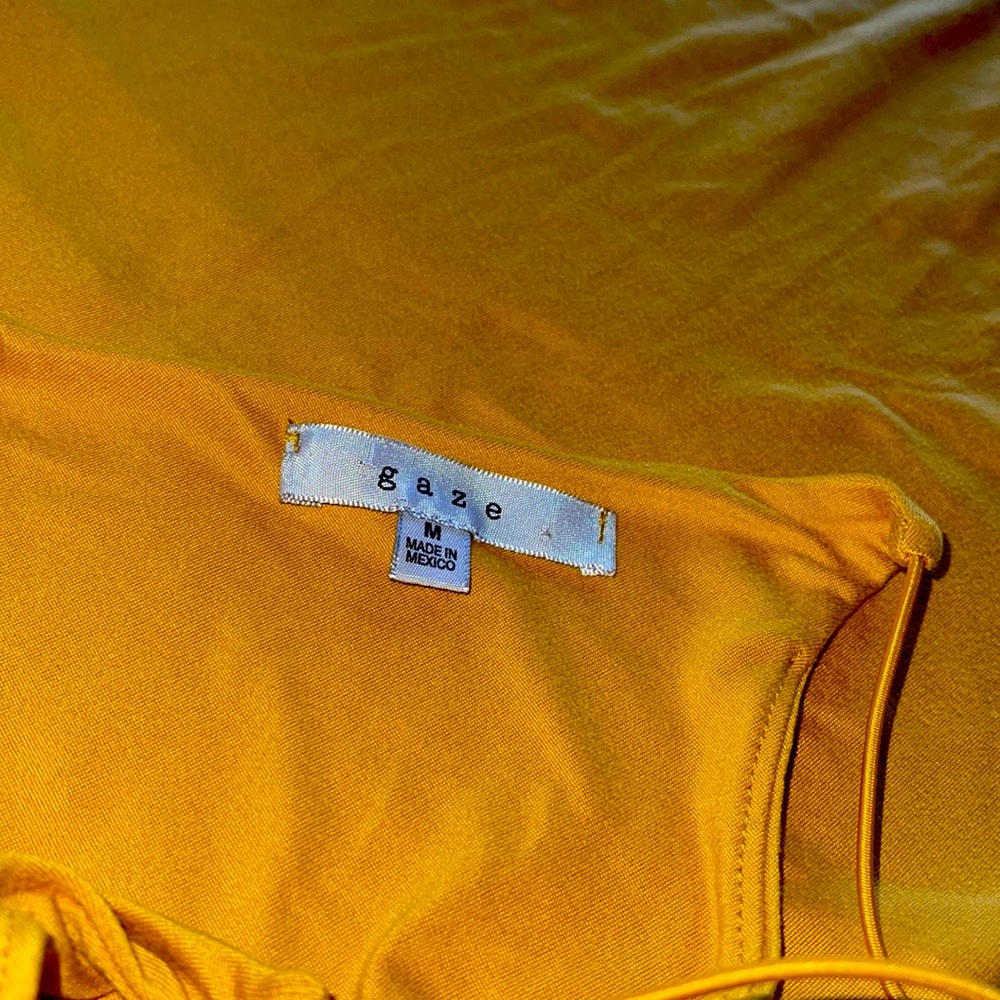 Yellow Gaze onesie. Size medium